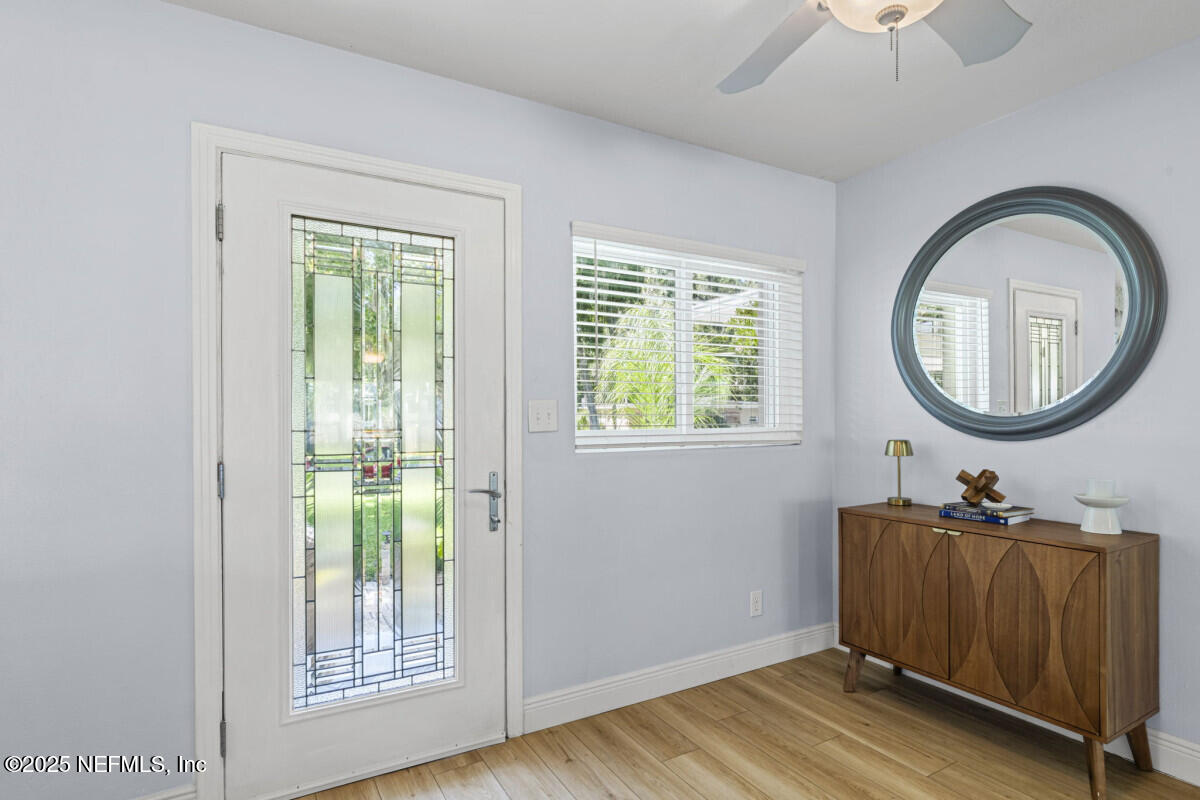 1901 Tanglewood Road Jacksonville Beach, FL 32250 - Photo 25 of 48 a room with a mirror and a window