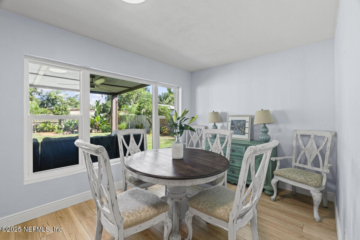 1901 Tanglewood Road Jacksonville Beach, FL 32250 - Photo 28 of 48 a view of a dining room with furniture window and outside view