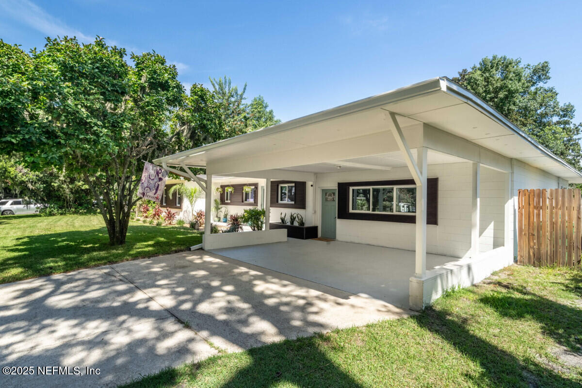 1901 Tanglewood Road Jacksonville Beach, FL 32250 - Photo 31 of 48 a front view of a house with garden