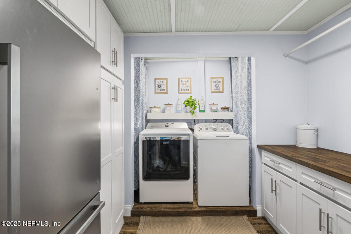 1901 Tanglewood Road Jacksonville Beach, FL 32250 - Photo 33 of 48 a utility room with dryer and washer