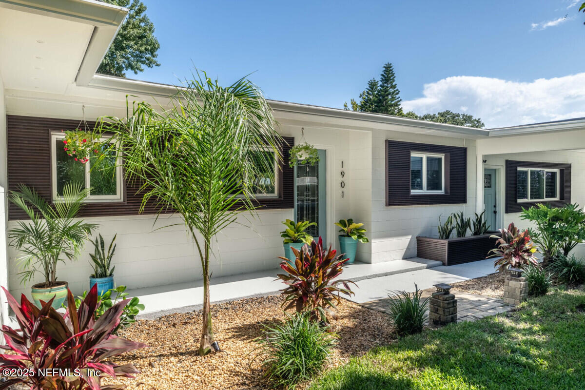 1901 Tanglewood Road Jacksonville Beach, FL 32250 - Photo 36 of 48 a view of a house with a yard
