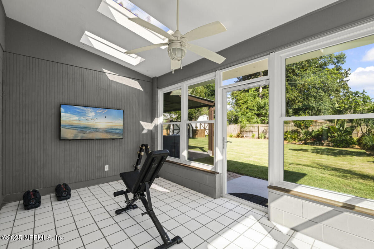 1901 Tanglewood Road Jacksonville Beach, FL 32250 - Photo 38 of 48 a view of a workspace with furniture and a window