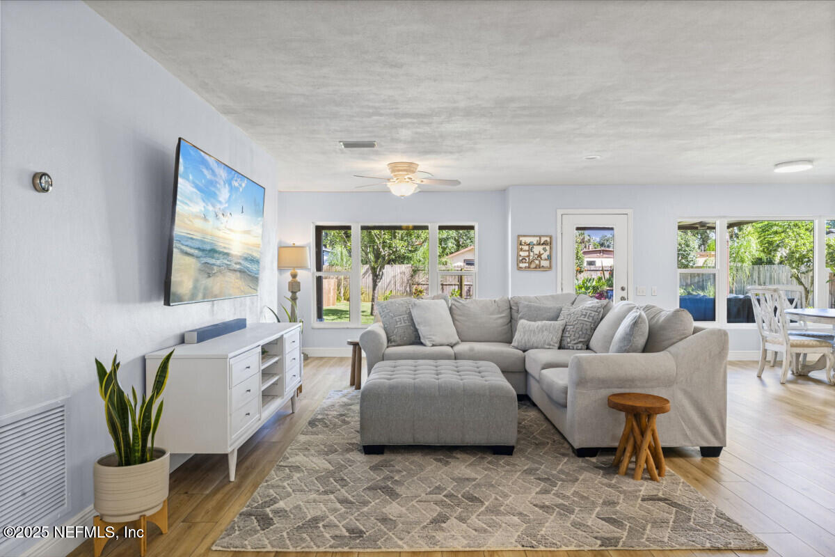1901 Tanglewood Road Jacksonville Beach, FL 32250 - Photo 40 of 48 a living room with furniture and a large window