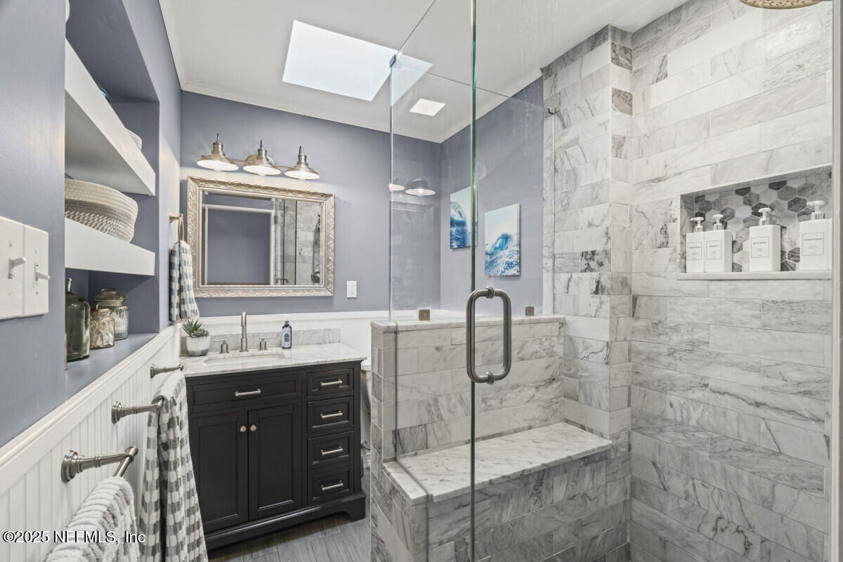 1901 Tanglewood Road Jacksonville Beach, FL 32250 - Photo 44 of 48 a bathroom with a double vanity sink mirror and shower