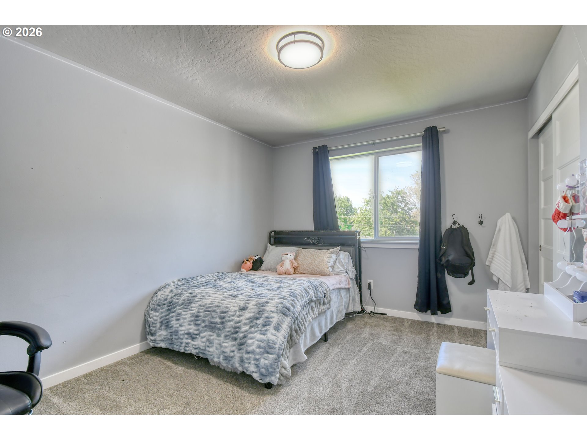 233 East Jefferson Street Athena, OR 97813 - Photo 21 of 36 a bedroom with a bed and a large window
