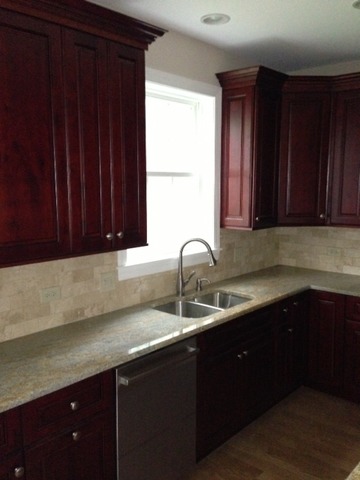246 Highland Road Willowbrook, IL 60527 - Photo 2 of 6 a kitchen with a sink and cabinets