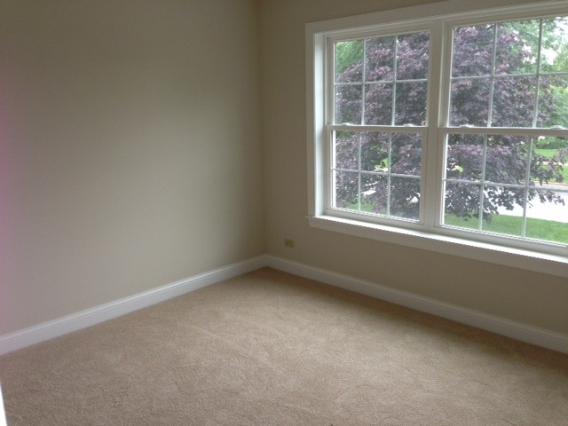 246 Highland Road Willowbrook, IL 60527 - Photo 6 of 6 an empty room with a window