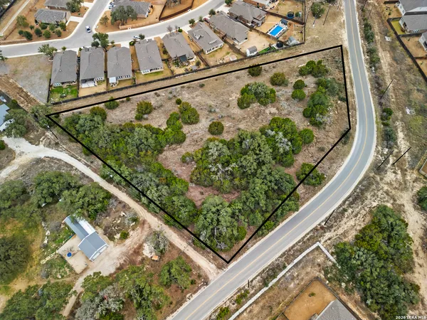a view of a yard from a balcony