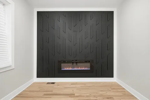 a view of an empty room and wooden floor