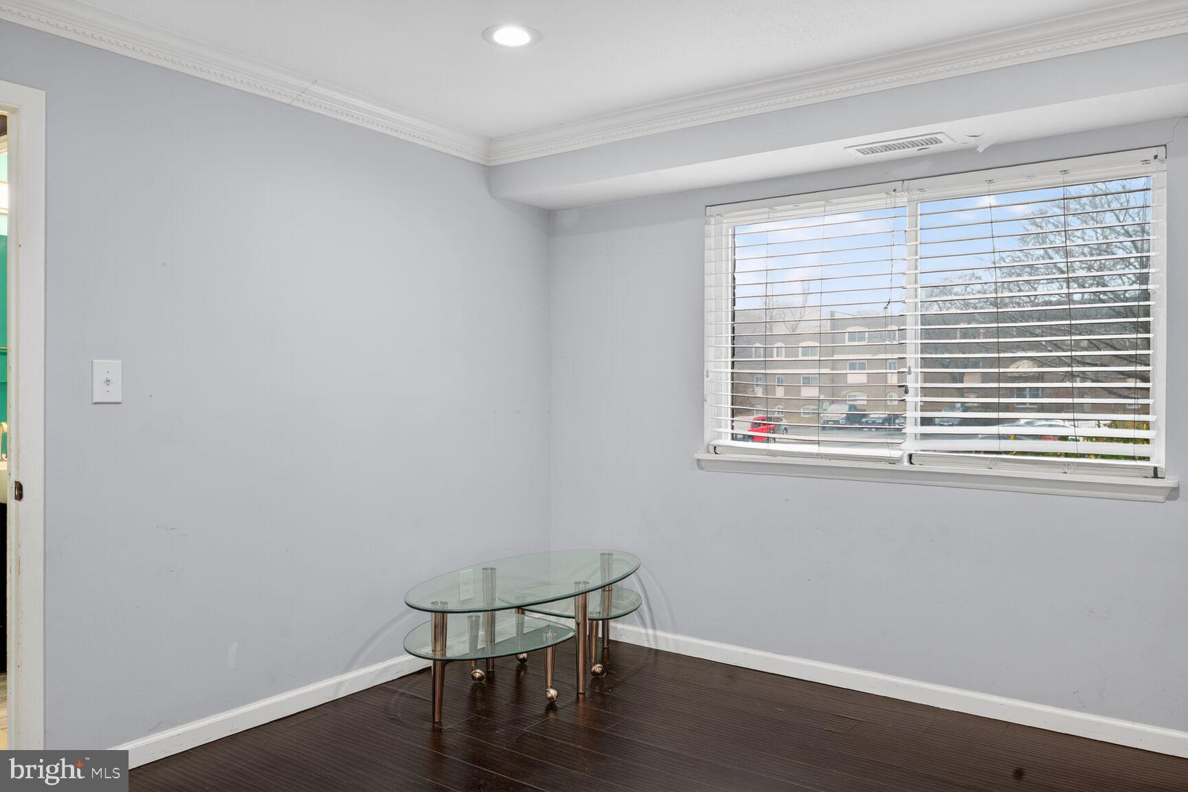 11903 E Tarragon Road, Unit E Reisterstown, MD 21136 - Photo 11 of 13 a view of a room with wooden floor and a window
