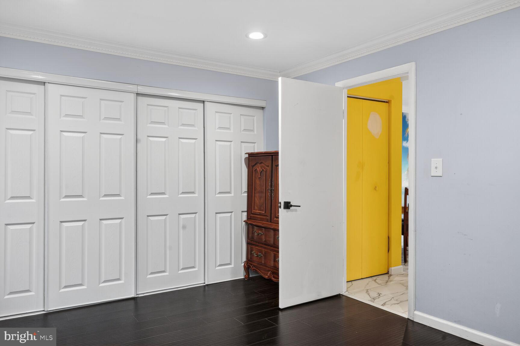 11903 E Tarragon Road, Unit E Reisterstown, MD 21136 - Photo 13 of 13 an empty room with wooden floor closet and front door