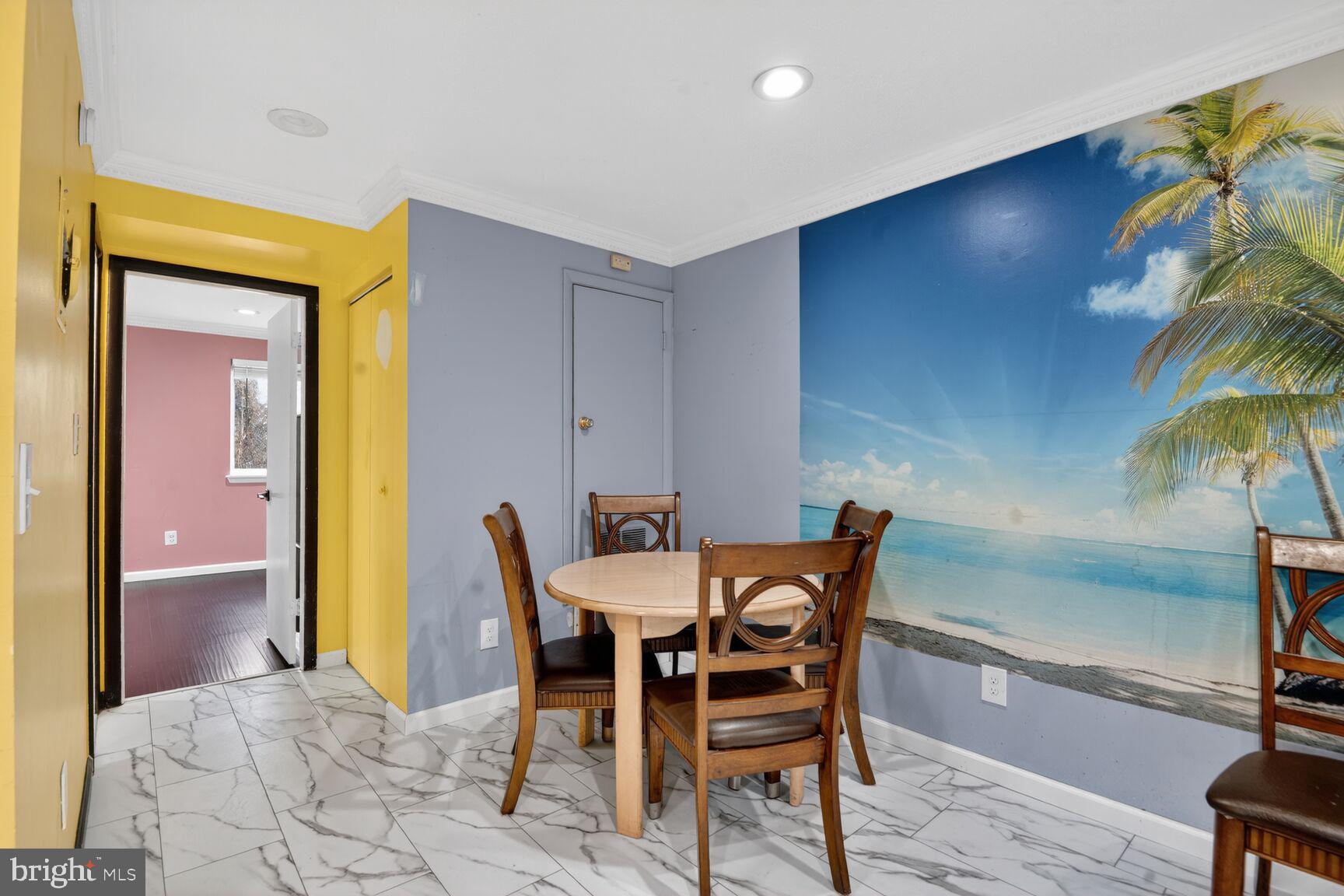11903 E Tarragon Road, Unit E Reisterstown, MD 21136 - Photo 7 of 13 a view of a dining room with furniture and chandelier