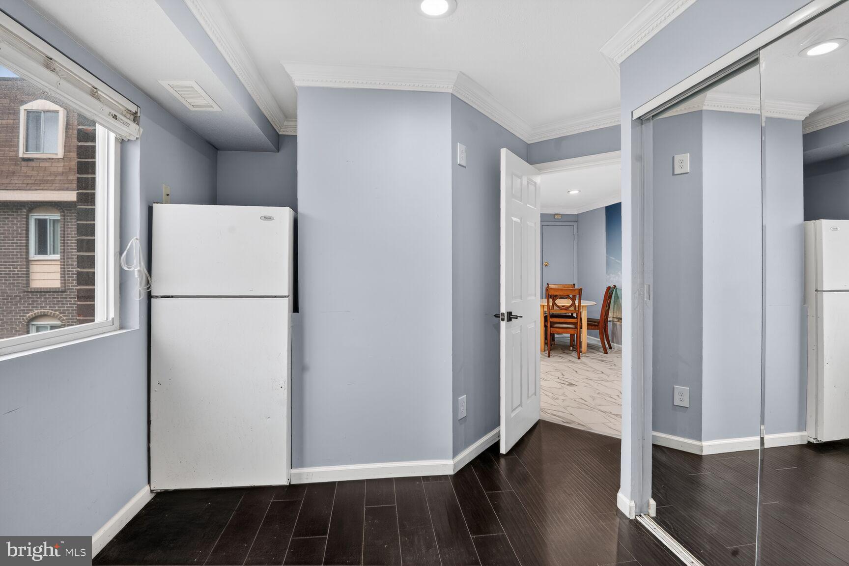 11903 E Tarragon Road, Unit E Reisterstown, MD 21136 - Photo 9 of 13 a view of a hallway with wooden floor and closet