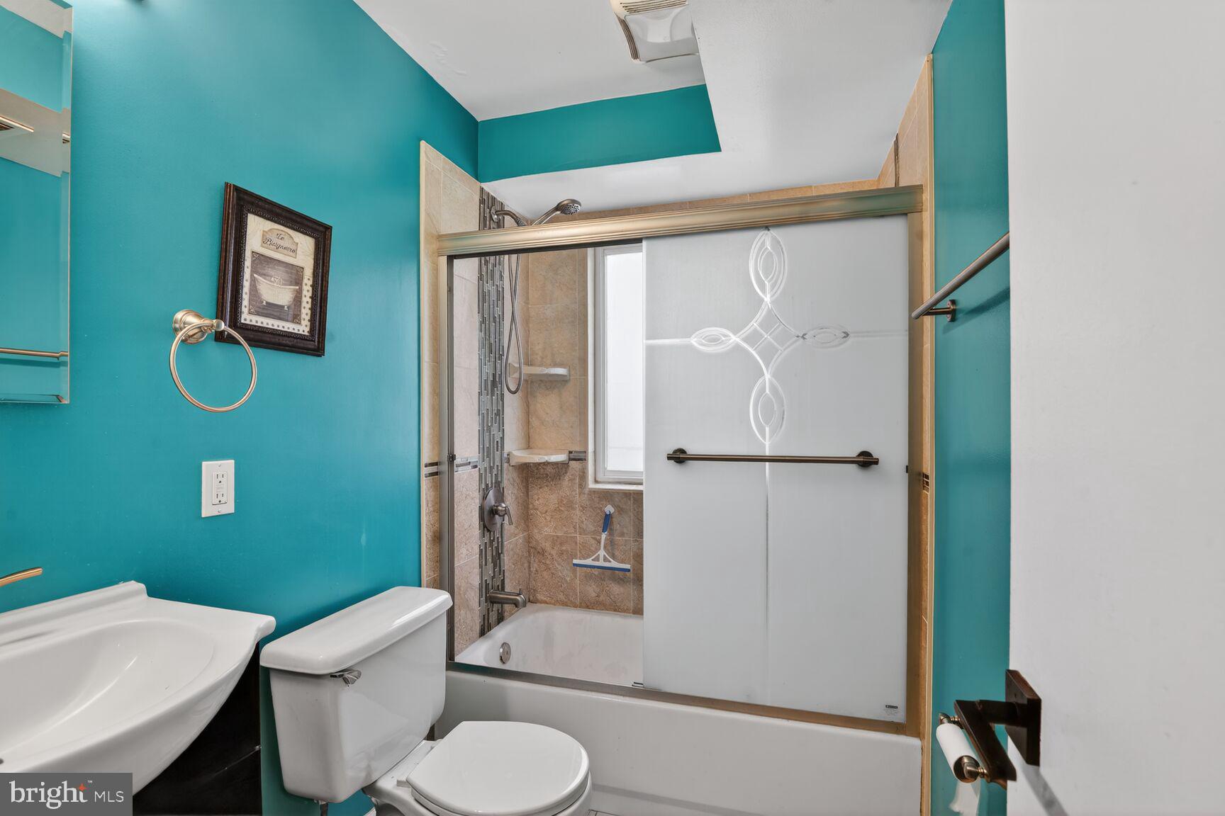 11903 E Tarragon Road, Unit E Reisterstown, MD 21136 - Photo 10 of 13 a bathroom with a toilet a sink and shower