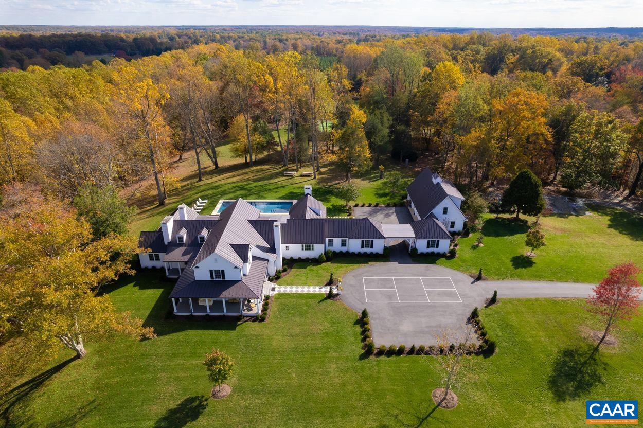 4545 Louisa Road Keswick, VA 22947 - Photo 2 of 51 an aerial view of a house with a garden and lake view