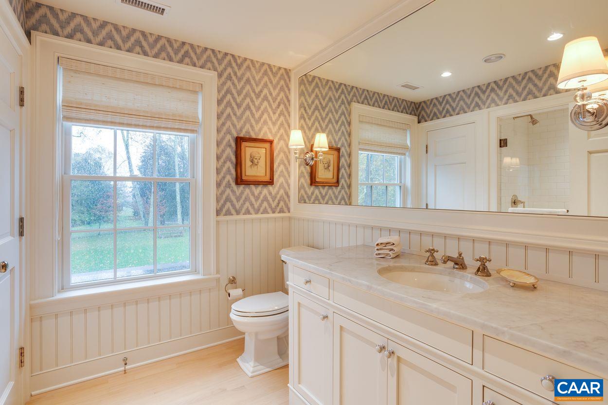 4545 Louisa Road Keswick, VA 22947 - Photo 36 of 51 a bathroom with a sink toilet and vanity