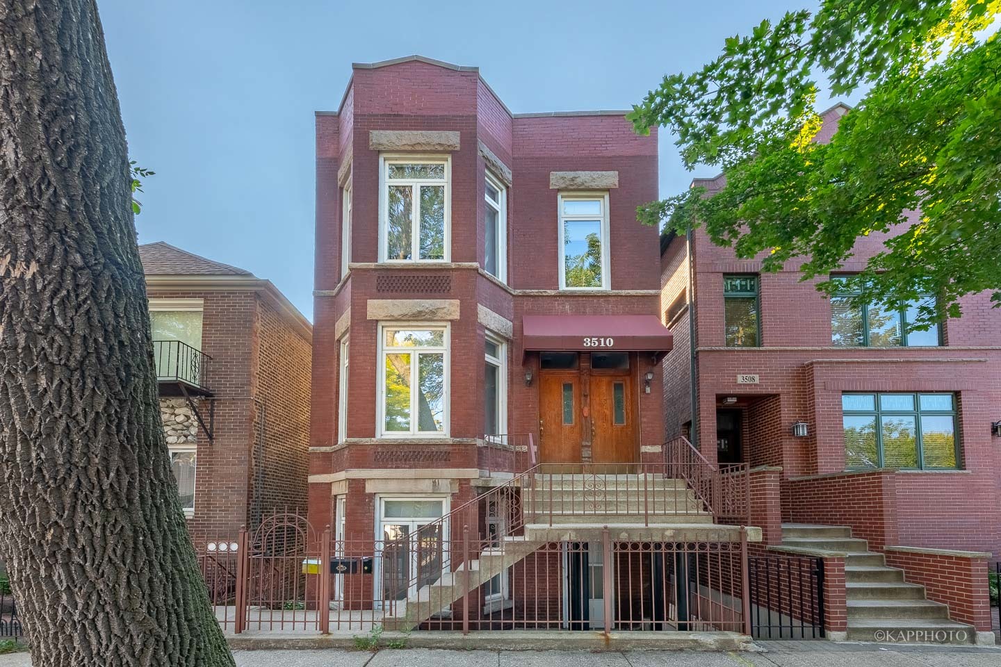 3510 South Union Avenue, Unit 1 Chicago, IL 60609 - Photo 1 of 18 a front view of a residential apartment building with a yard