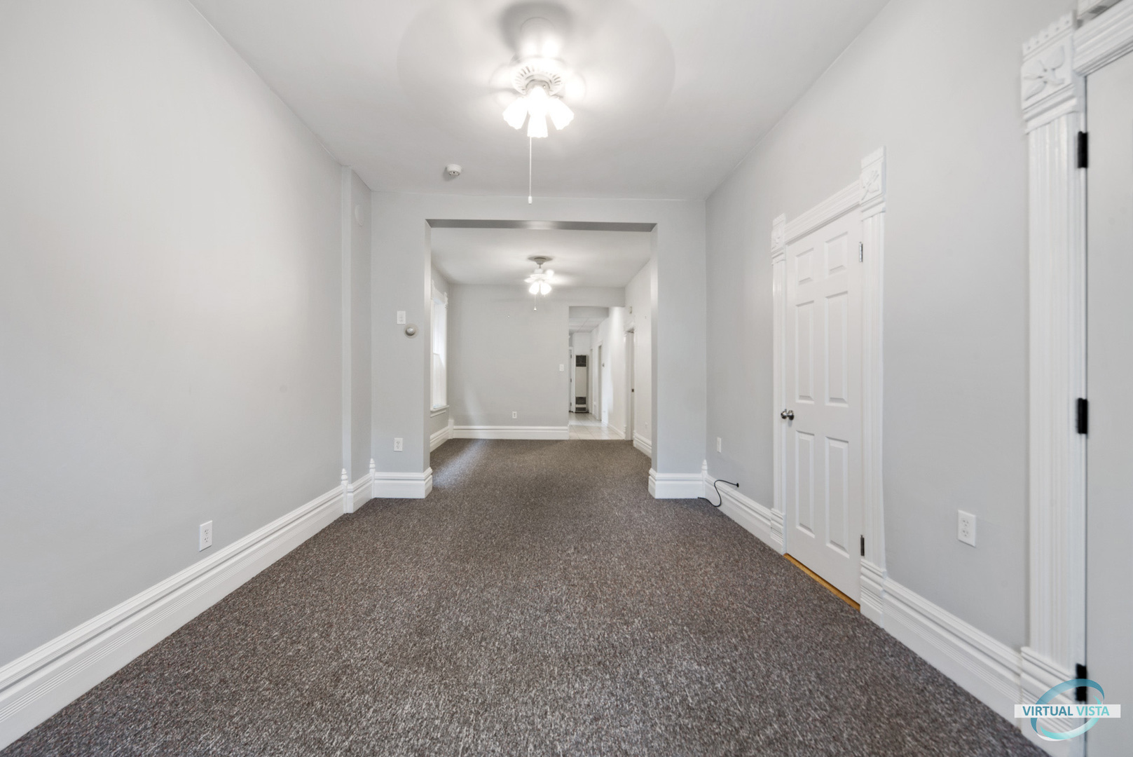 3510 South Union Avenue, Unit 1 Chicago, IL 60609 - Photo 4 of 18 a view of a big room with a chandelier fan and windows