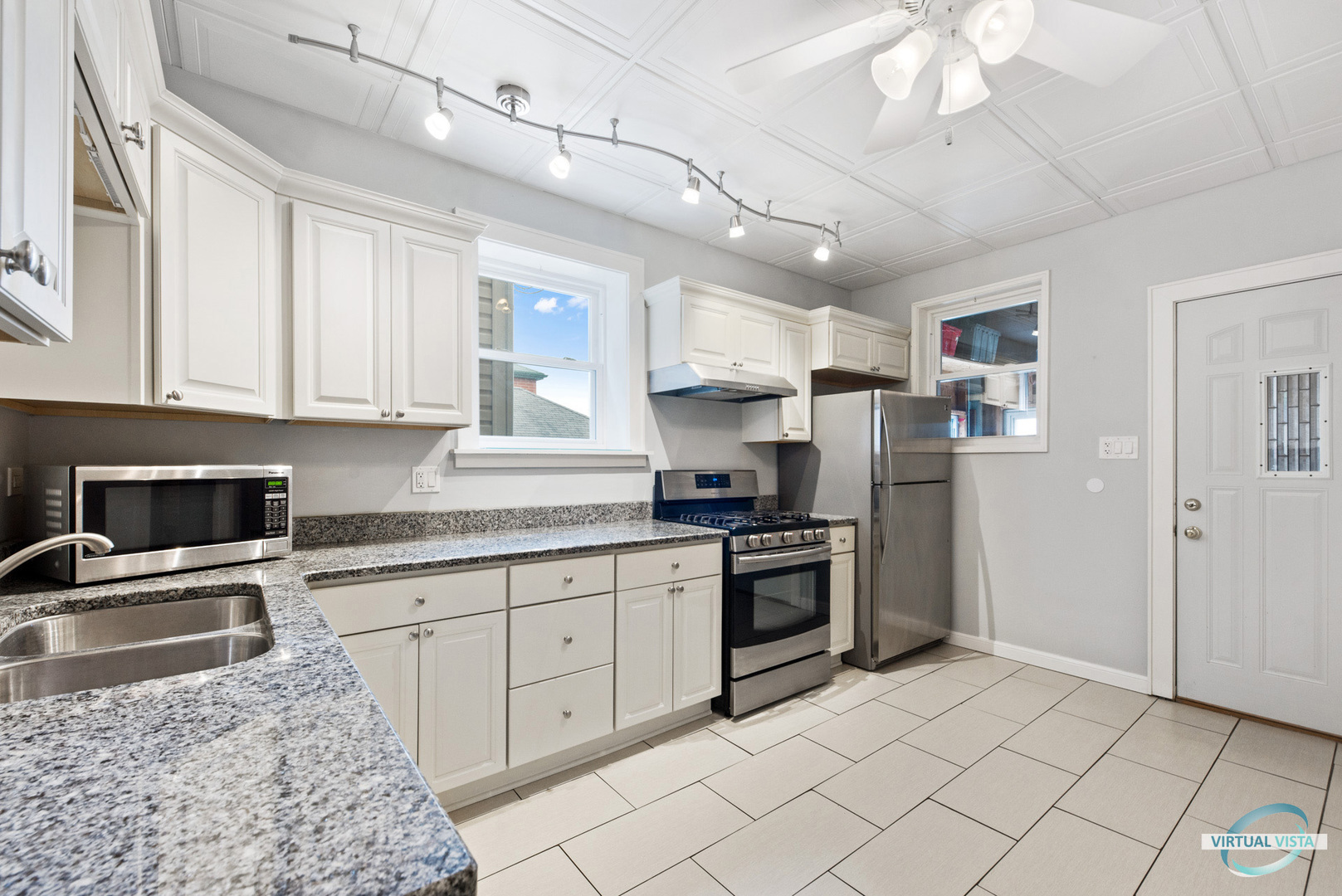 3510 South Union Avenue, Unit 1 Chicago, IL 60609 - Photo 9 of 18 a kitchen with stainless steel appliances granite countertop a stove sink and cabinets