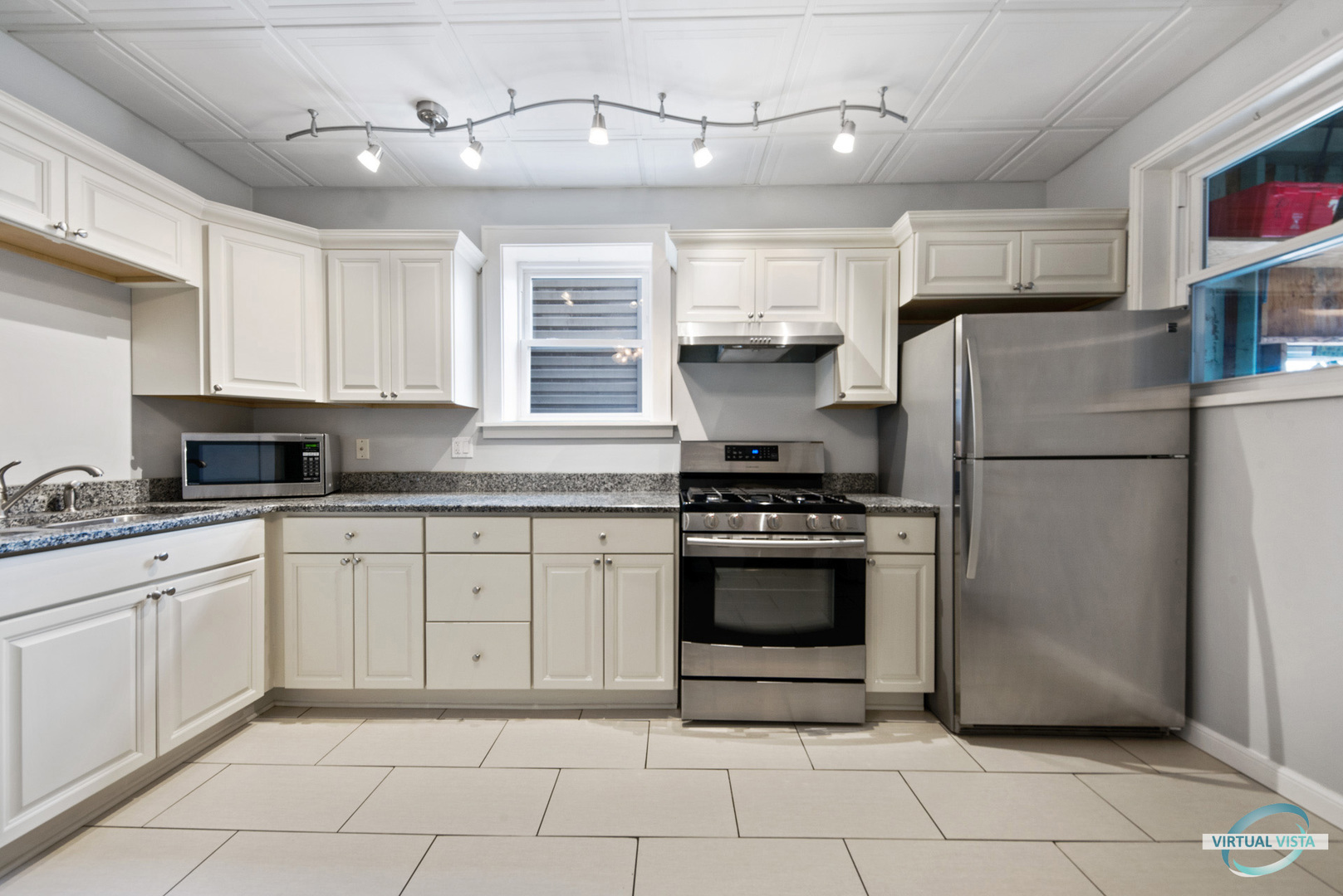 3510 South Union Avenue, Unit 1 Chicago, IL 60609 - Photo 10 of 18 a kitchen with stainless steel appliances granite countertop a refrigerator sink and cabinets