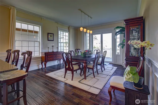 a view of a dining room with furniture window and wooden floor