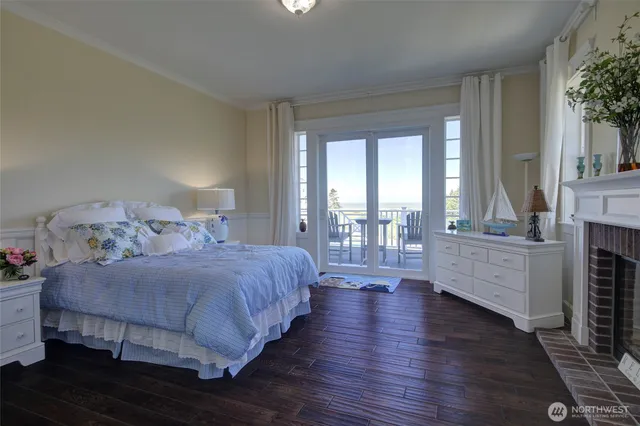 a bedroom with a large bed and a large window