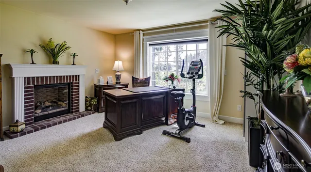 a room with furniture and a fireplace