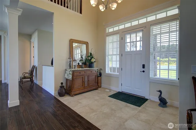 a living room with a bed furniture and a window