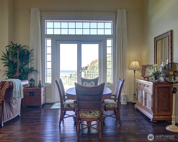 a view of a dining room with furniture window and wooden floor