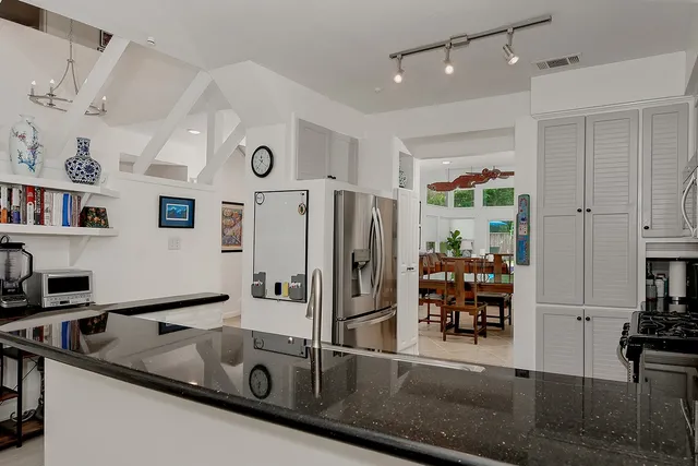 a view of a dining room with furniture and window