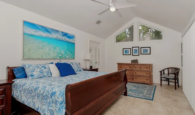 a bedroom with a bed and a table in it