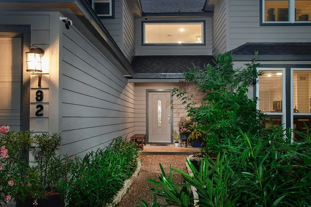 a view of a pathway besides a house