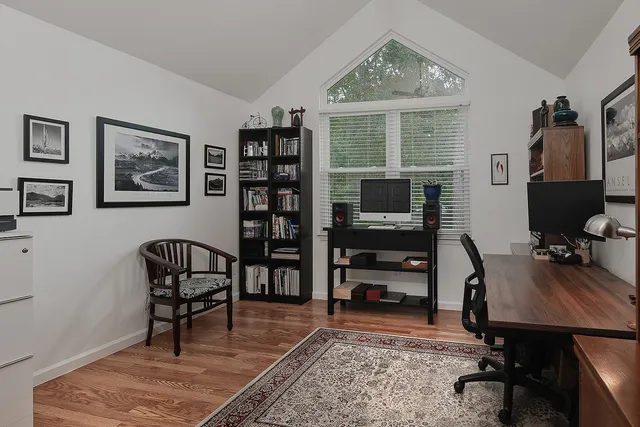 a patio with swimming pool table and chairs