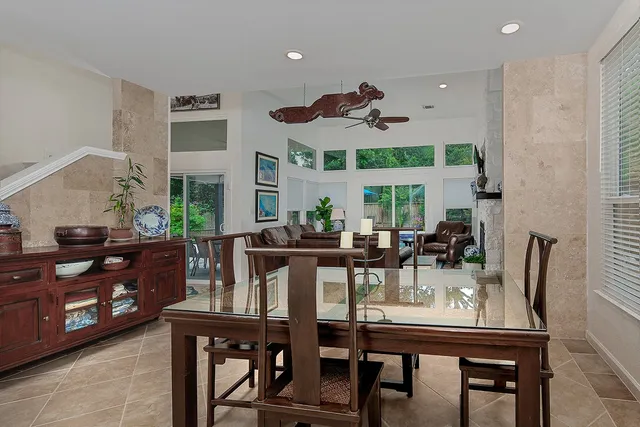a view of a dining room with furniture and window