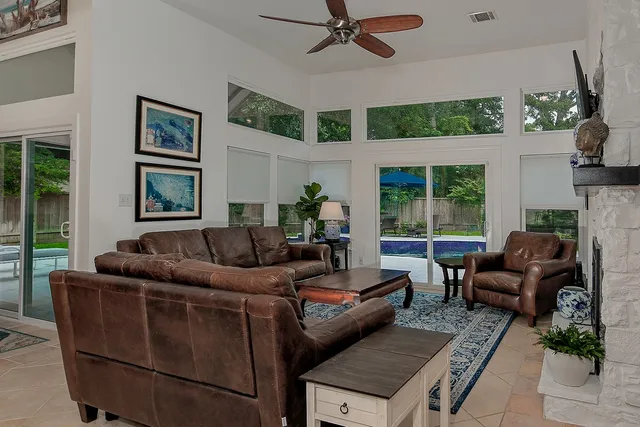 a living room with furniture and a large window
