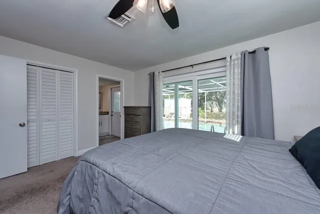 a view of empty room with ceiling fan