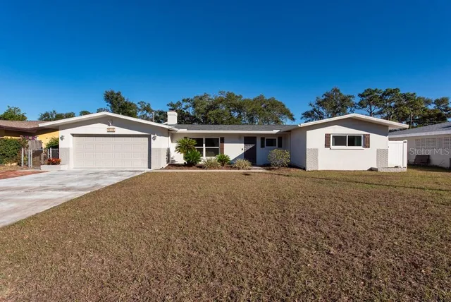 an aerial view of a house with a garden