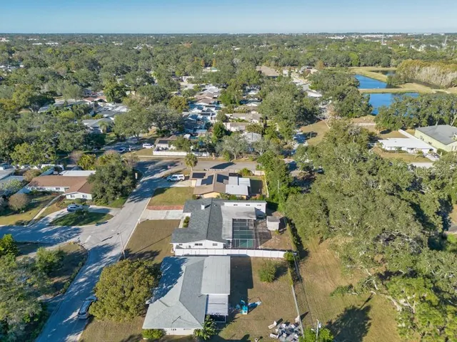 an aerial view of house with yard swimming pool and outdoor seating