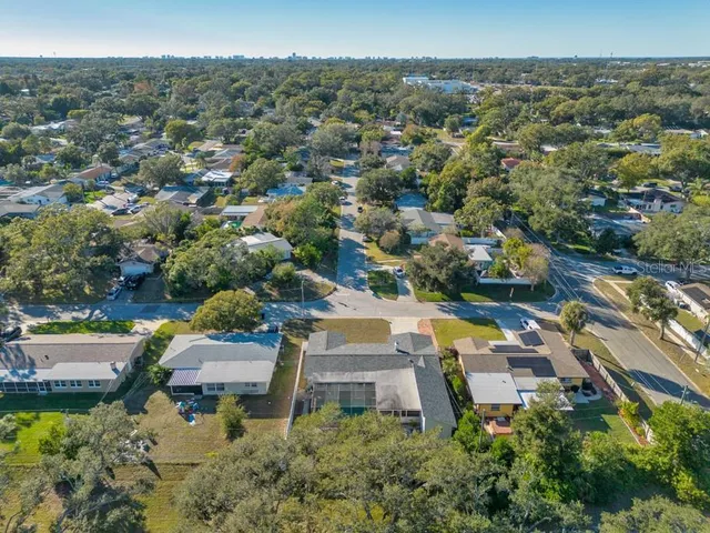 an aerial view of residential houses with outdoor space