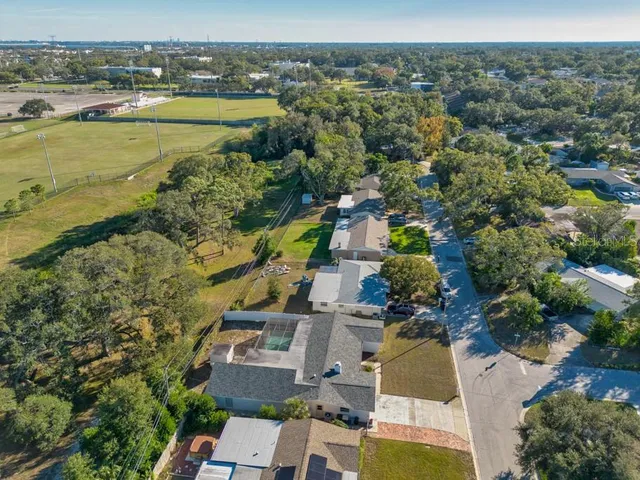 an aerial view of a house with a yard and garage