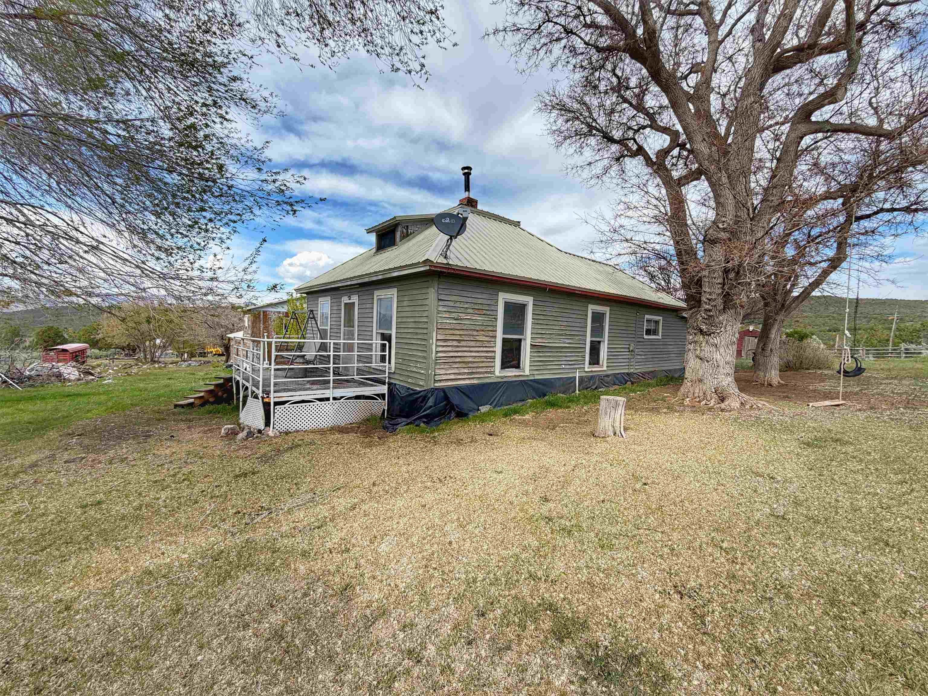 11260 54 7/10 Road Molina, CO 81646 - Photo 28 of 31 a view of a house with a yard