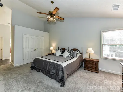 a bed room with a bed and a window