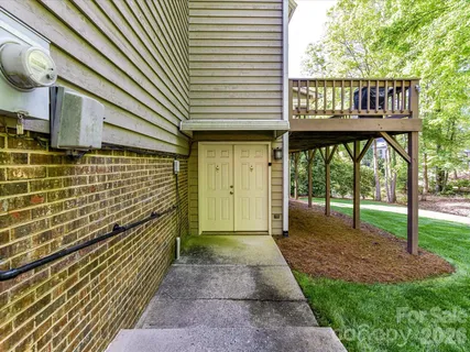 a view of a porch with wooden floor