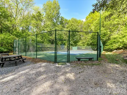 a view of a swimming pool with an outdoor seating