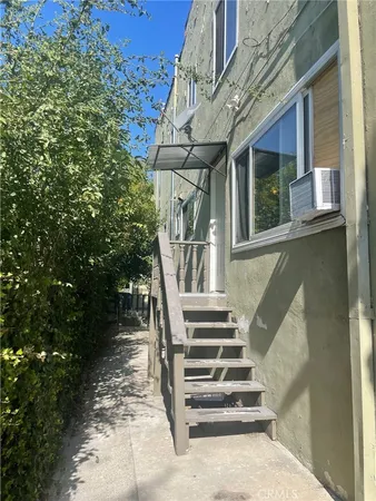 a view of a pathway of a house with a trees