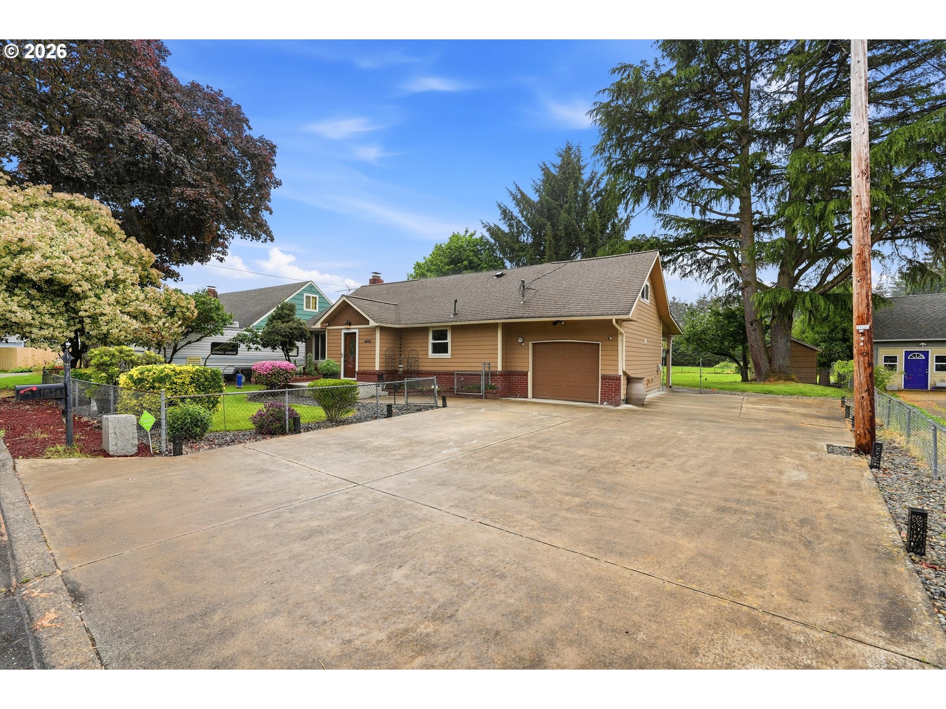 4621 Ohio Street Longview, WA 98632 - Photo 3 of 29 a front view of a house with a yard and garage