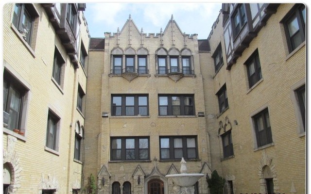 5655 North Spaulding Avenue, Unit 2W Chicago, IL 60659 - Photo 2 of 13 a view of a large building with many windows