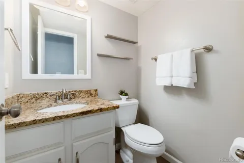 a spacious bedroom with a bed and a couch