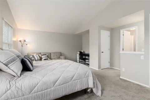 a bathroom with a granite countertop sink toilet and a mirror