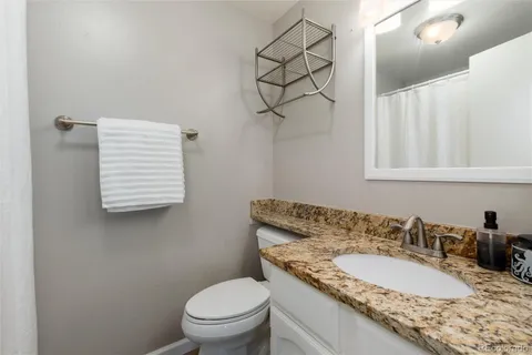 a bedroom with a bed and dresser with window